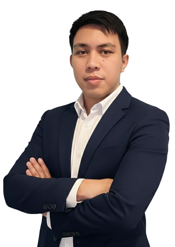 Business professional in navy suit with arms crossed against white background